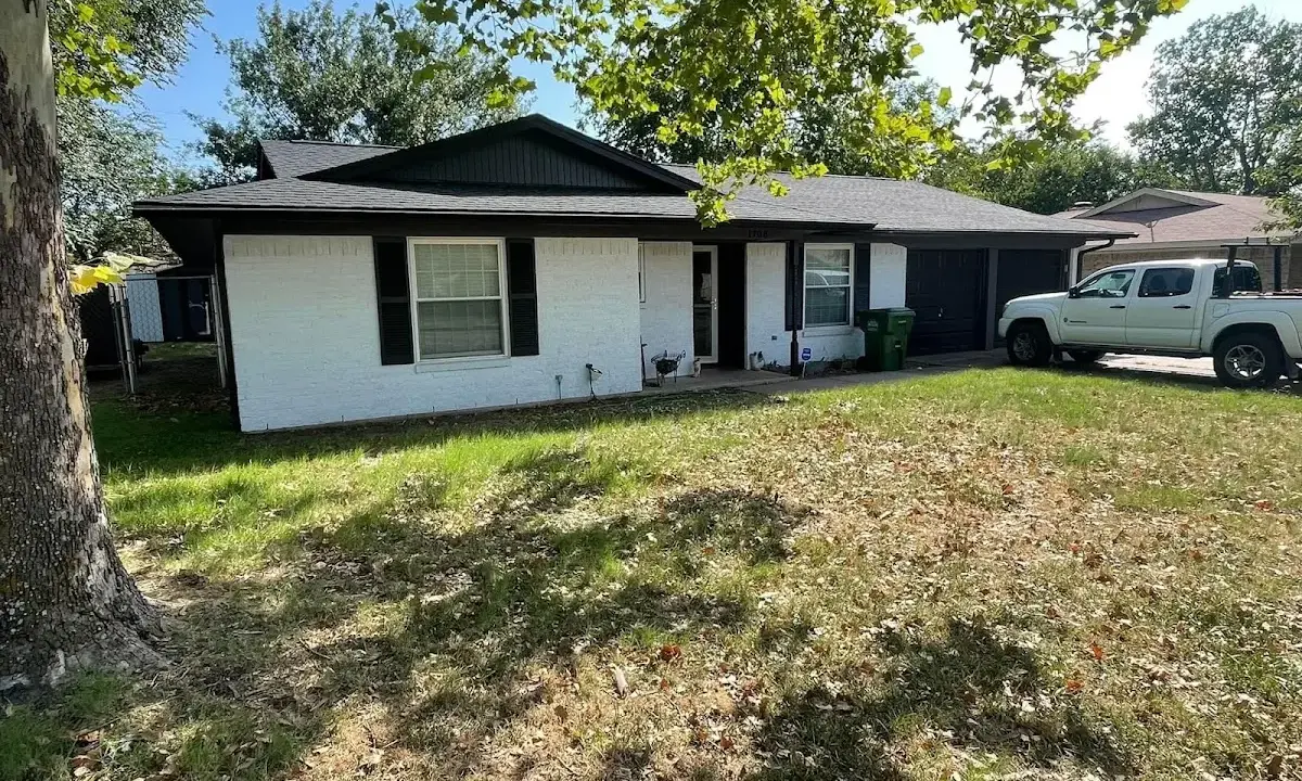 Professional roofing crew working on a residential roof in Dyersburg